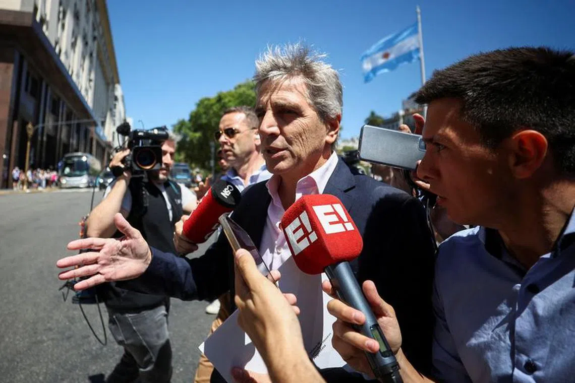 FILE PHOTO: Argentina's Minister of Economy Luis Caputo speaks to the press, one day after the inauguration of Argentina's President Javier Milei, in Buenos Aires, Argentina, December 11, 2023. REUTERS/Agustin Marcarian/File Photo