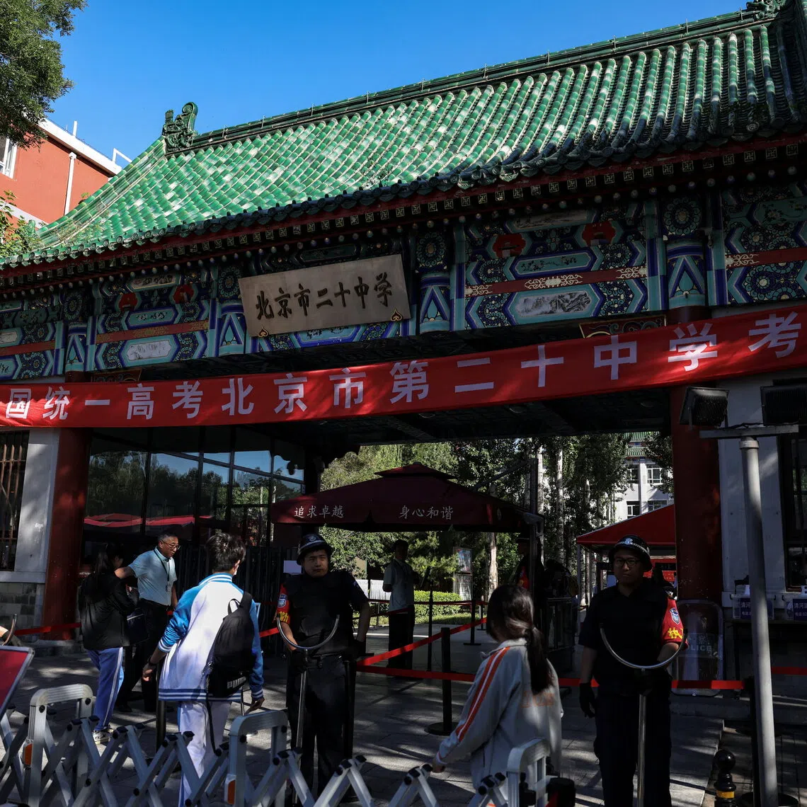 Students entering a high school to take part in the annual national college entrance exam, or “gaokao”, in Beijing, China on June 7.