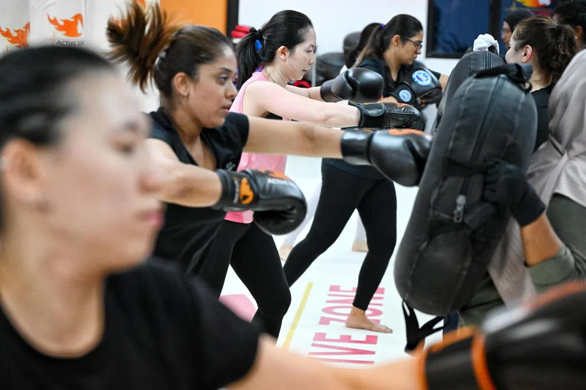 Active Zone’s all-white training space is less intimidating than other kickboxing venues, which usually have black as a dominant colour. ST PHOTO: KUA CHEE SIONG 