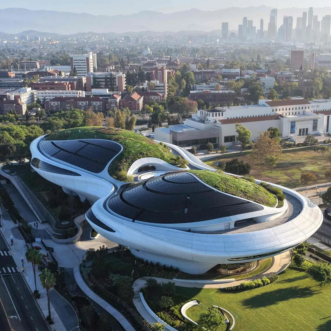 The museum’s unusual design – a green roof that blends into the surrounding landscape – is meant to offer a glimpse of the future and spark visitors’ curiosity.