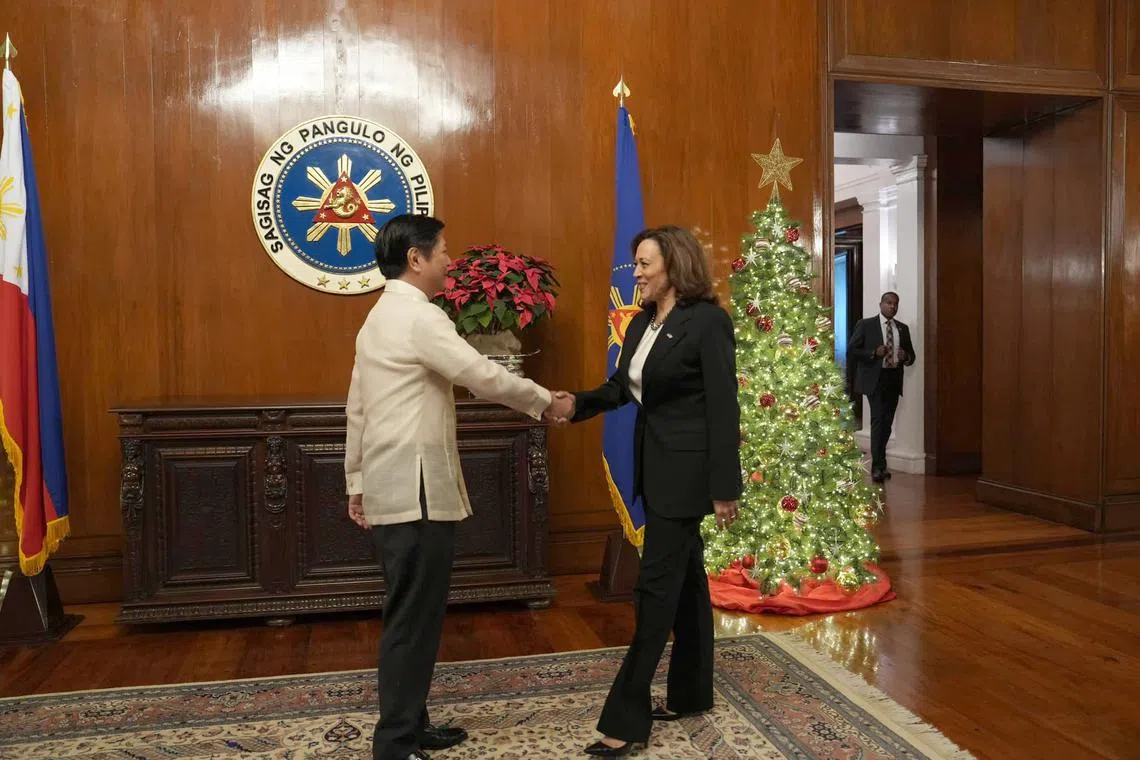 Philippine President Ferdinand Marcos Jr welcoming United States Vice-President Kamala Harris at his Manila office on November 21, 2022.
