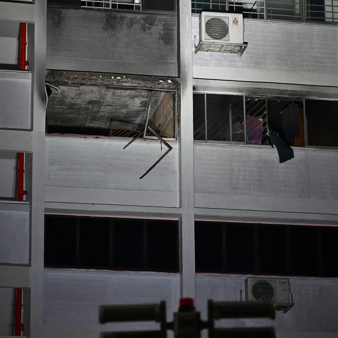 Police officers had to force their entry into the locked flat in an attempt to save the occupants.