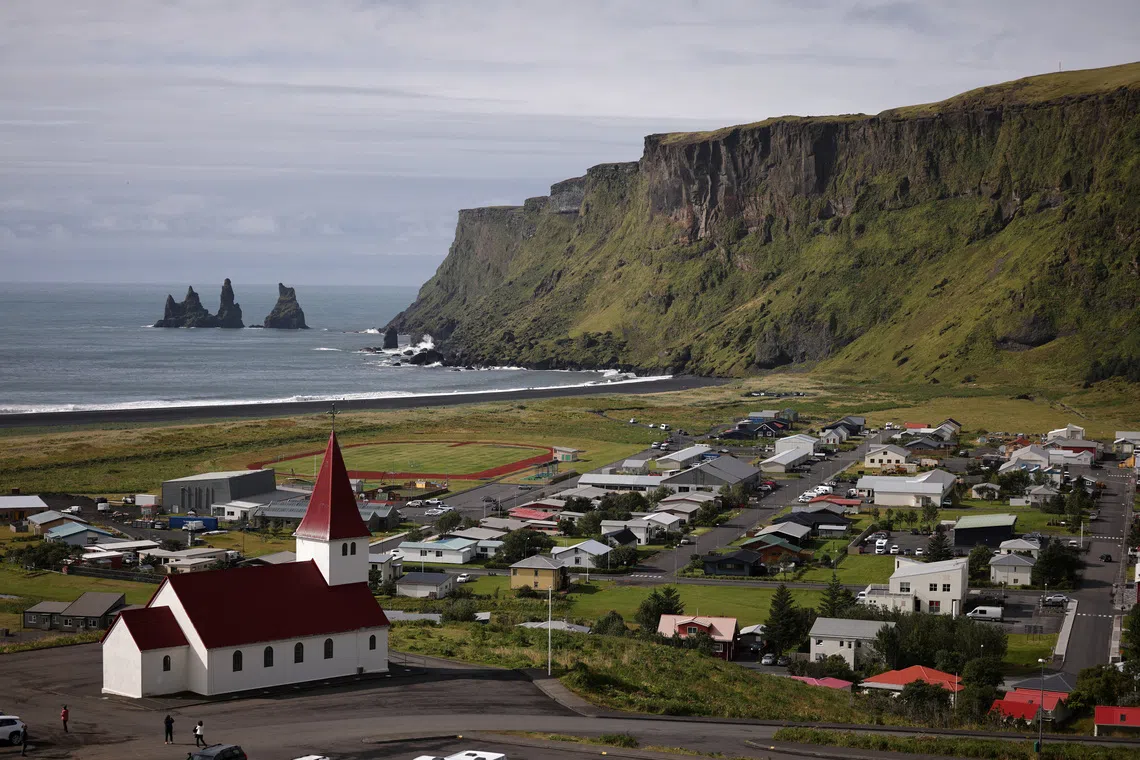FILE PHOTO: A general view shows the village of Vik, which would be at risk of glacier floods if the Katla volcano erupts, in southwestern Iceland, August 13, 2024. REUTERS/Stoyan Nenov/File Photo