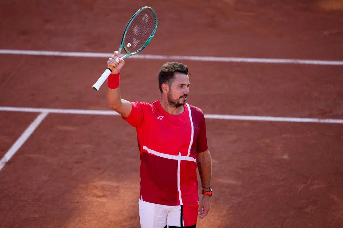 FILE PHOTO: Paris 2024 Olympics - Tennis - Men's Singles First Round - Roland-Garros Stadium, Paris, France - July 28, 2024. Stan Wawrinka of Switzerland celebrates after winning his first round match against Pavel Kotov of AIN. REUTERS/Aleksandra Szmigiel/File Photo