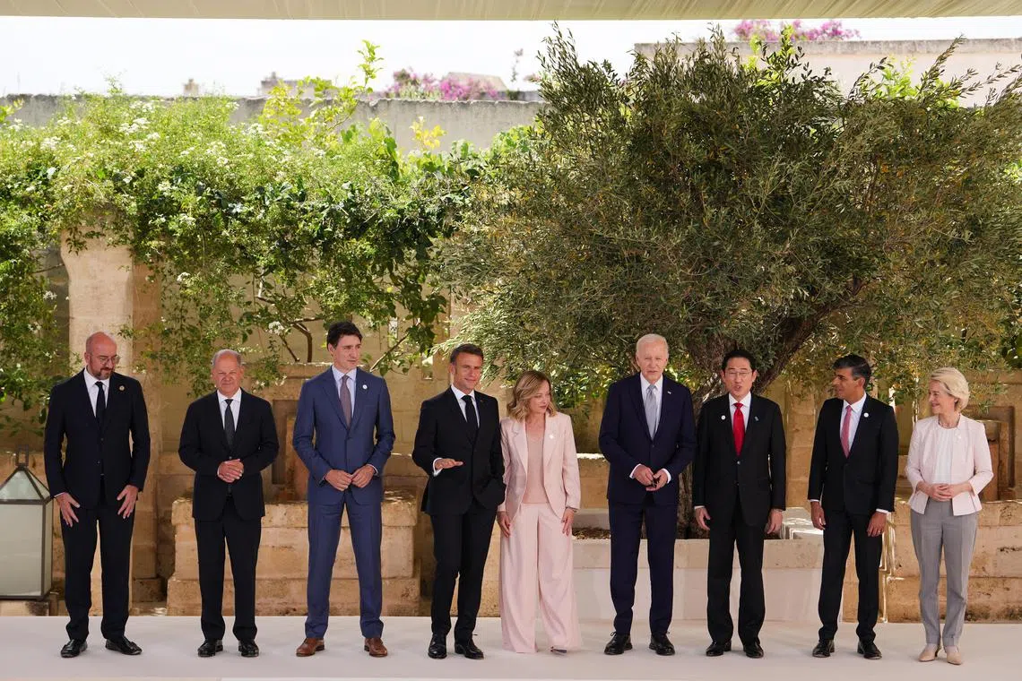 World leaders take a family photo at the outset of the annual G-7 summit, in Savelletri, Italy on June 13, 2024.