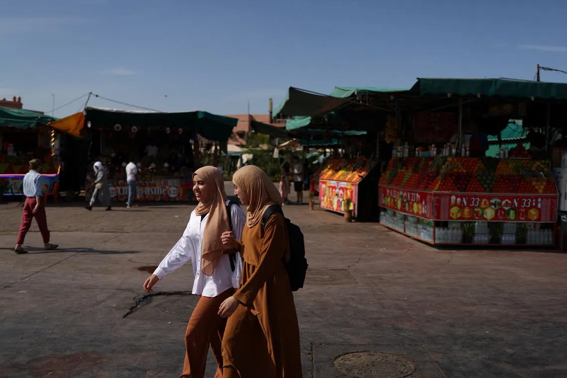 FILE PHOTO: People walk in Jemaa el-Fnaa square, in Marrakesh, Morocco, October 22, 2024. REUTERS/Stelios Misinas/File Photo