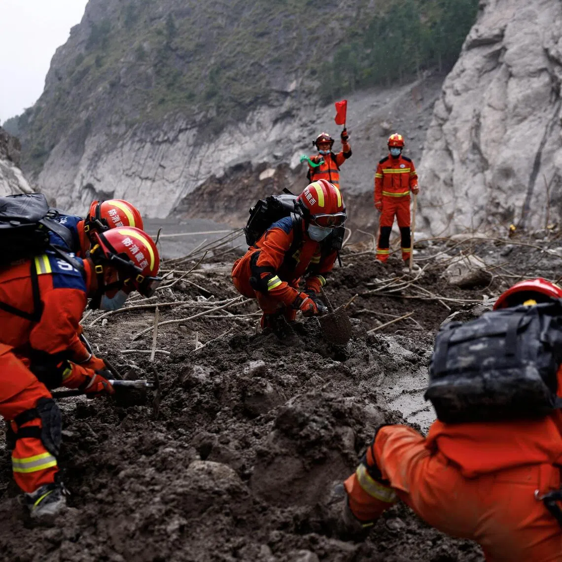 Rescue workers conduct search and rescue operations at the core disaster-hit area at Gyirong Port amid rescue efforts following the Aug 26 mudslide.