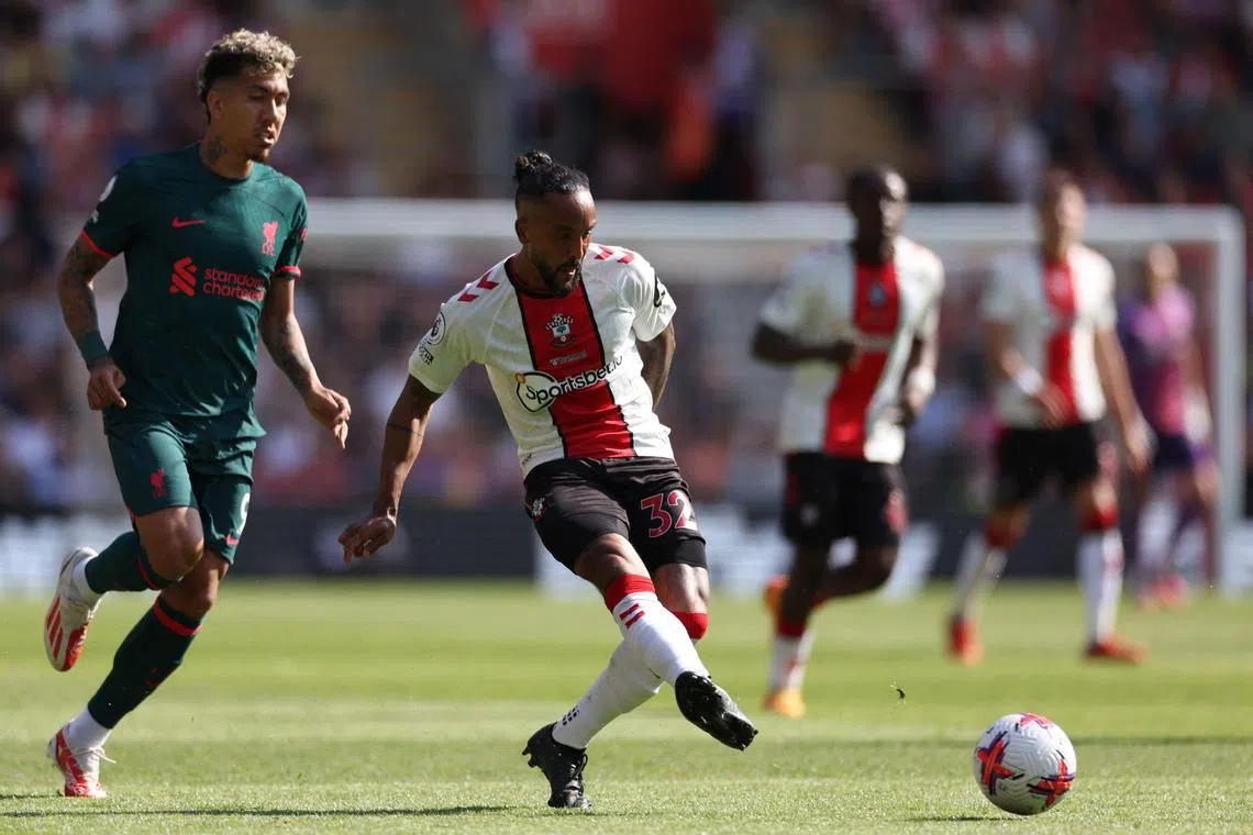 Southampton's English midfielder Theo Walcott passes the ball during the English Premier League football match between Southampton and Liverpool at St Mary's Stadium in Southampton, southern England on May 28, 2023. (Photo by Adrian DENNIS / AFP) / RESTRICTED TO EDITORIAL USE. No use with unauthorized audio, video, data, fixture lists, club/league logos or 'live' services. Online in-match use limited to 120 images. An additional 40 images may be used in extra time. No video emulation. Social media in-match use limited to 120 images. An additional 40 images may be used in extra time. No use in betting publications, games or single club/league/player publications. / 
