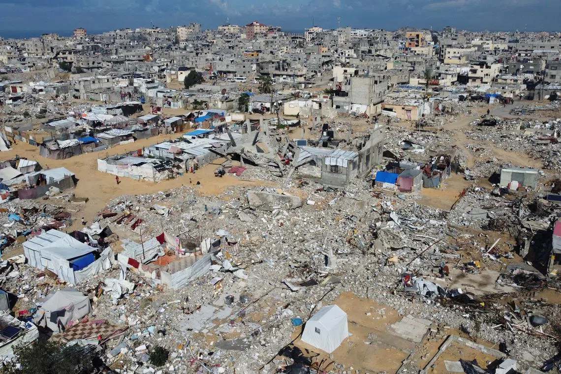 FILE PHOTO: A drone view shows damaged and destroyed buildings, destroyed in the Israeli military offensive, following a ceasefire between Israel and Hamas, in Khan Younis in the southern Gaza Strip January 24, 2025. REUTERS/Mohammed Salem/File Photo