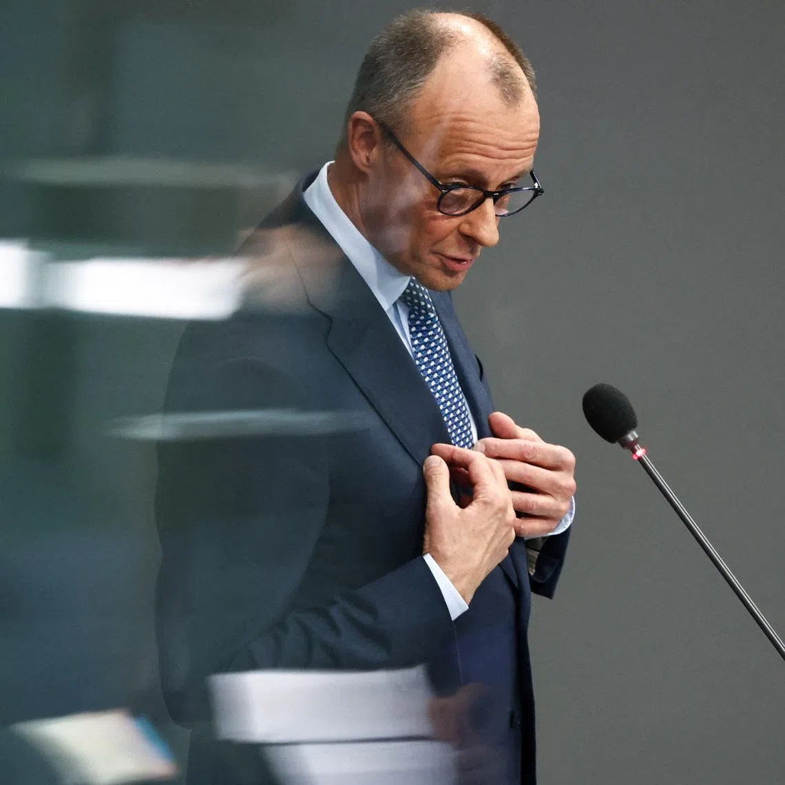 German Chancellor Friedrich Merz answers questions from lawmakers during a plenum session of the lower house of parliament, the Bundestag, in Berlin, Germany March 25, 2026.  REUTERS/Liesa Johannssen