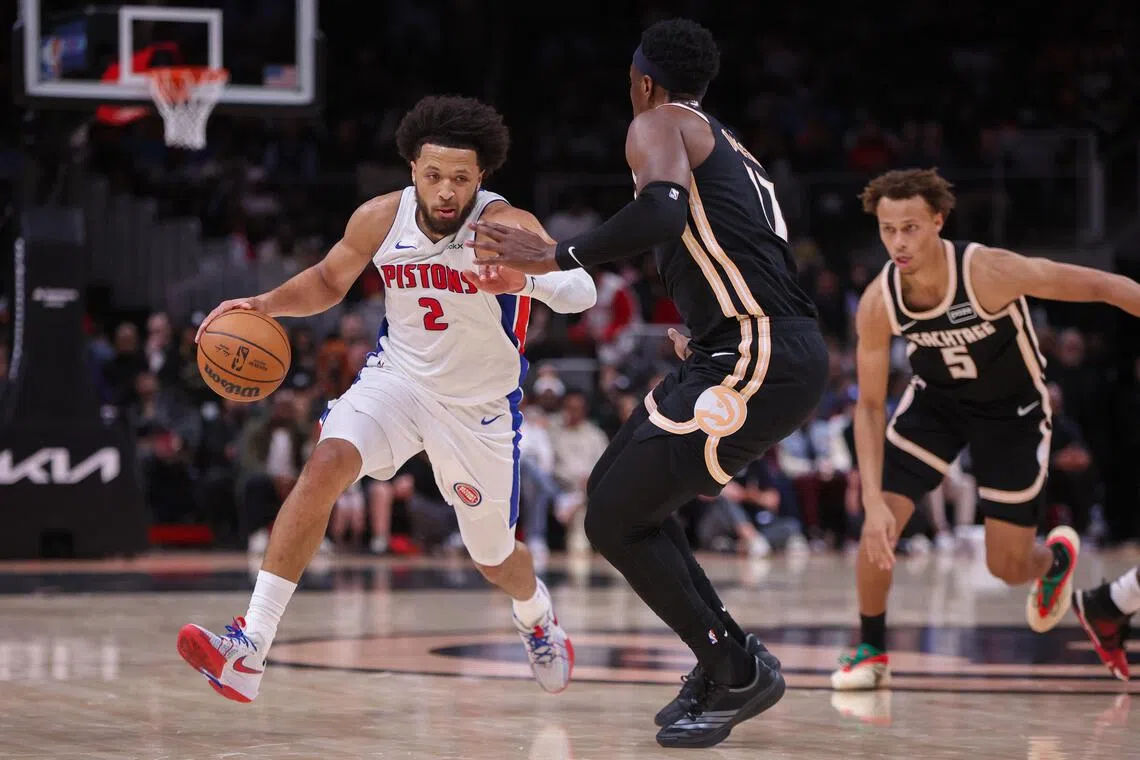 Detroit Pistons guard Cade Cunningham drives on Atlanta Hawks forward Onyeka Okongwu in the second quarter at State Farm Arena.