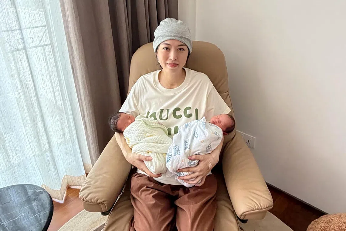 Former Singapore national table tennis player Yu Mengyu hopes her twins Asher (left) and Amelia will develop an interest in the sport.