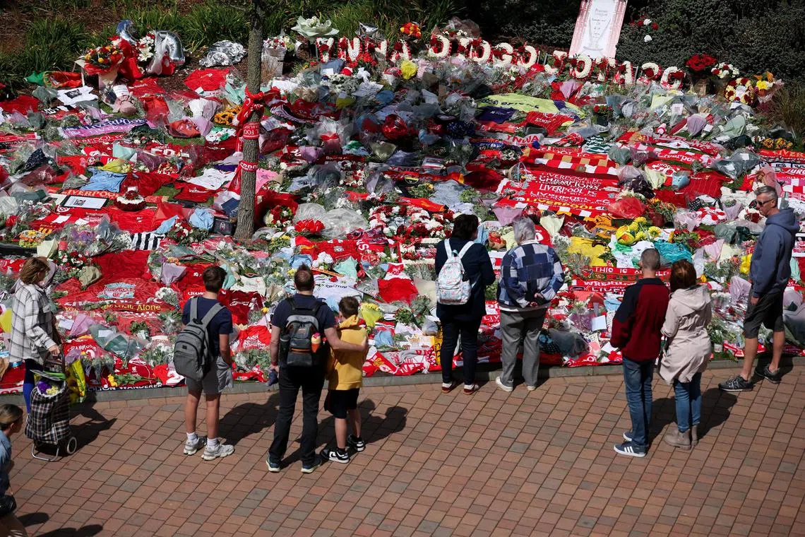 Fans pay their respects outside Anfield Stadium, following the death of Diogo Jota.