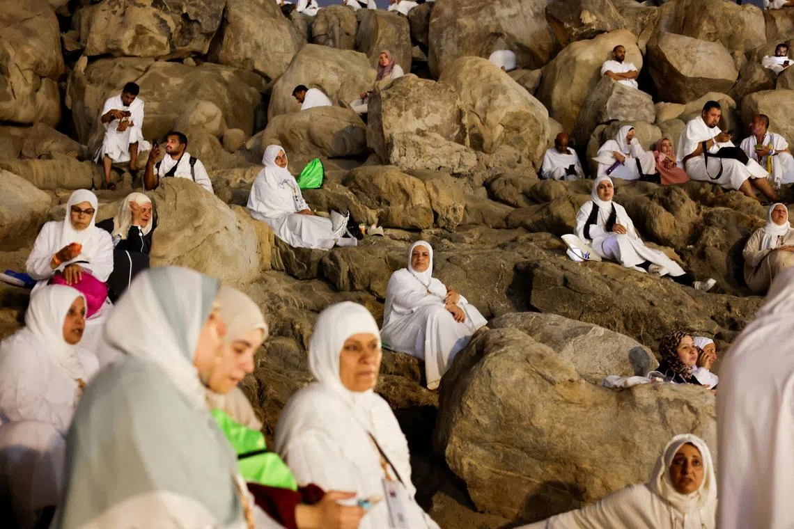 Muslim pilgrims gathering at Mount of Mercy on the plain of Arafat during the annual hajj pilgrimage, outside the holy city of Mecca, Saudi Arabia, May 26, 2026. 
