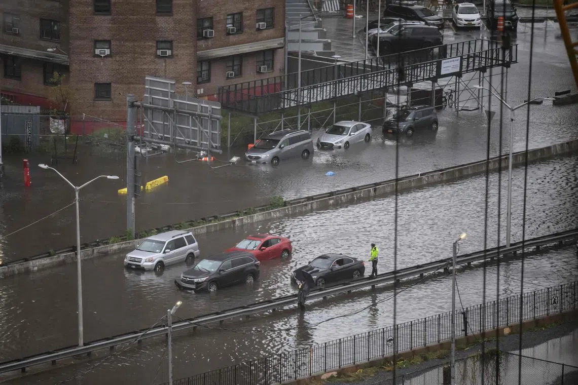 Cars stranded in flood water in Manhattan, New York, on Sept 29.