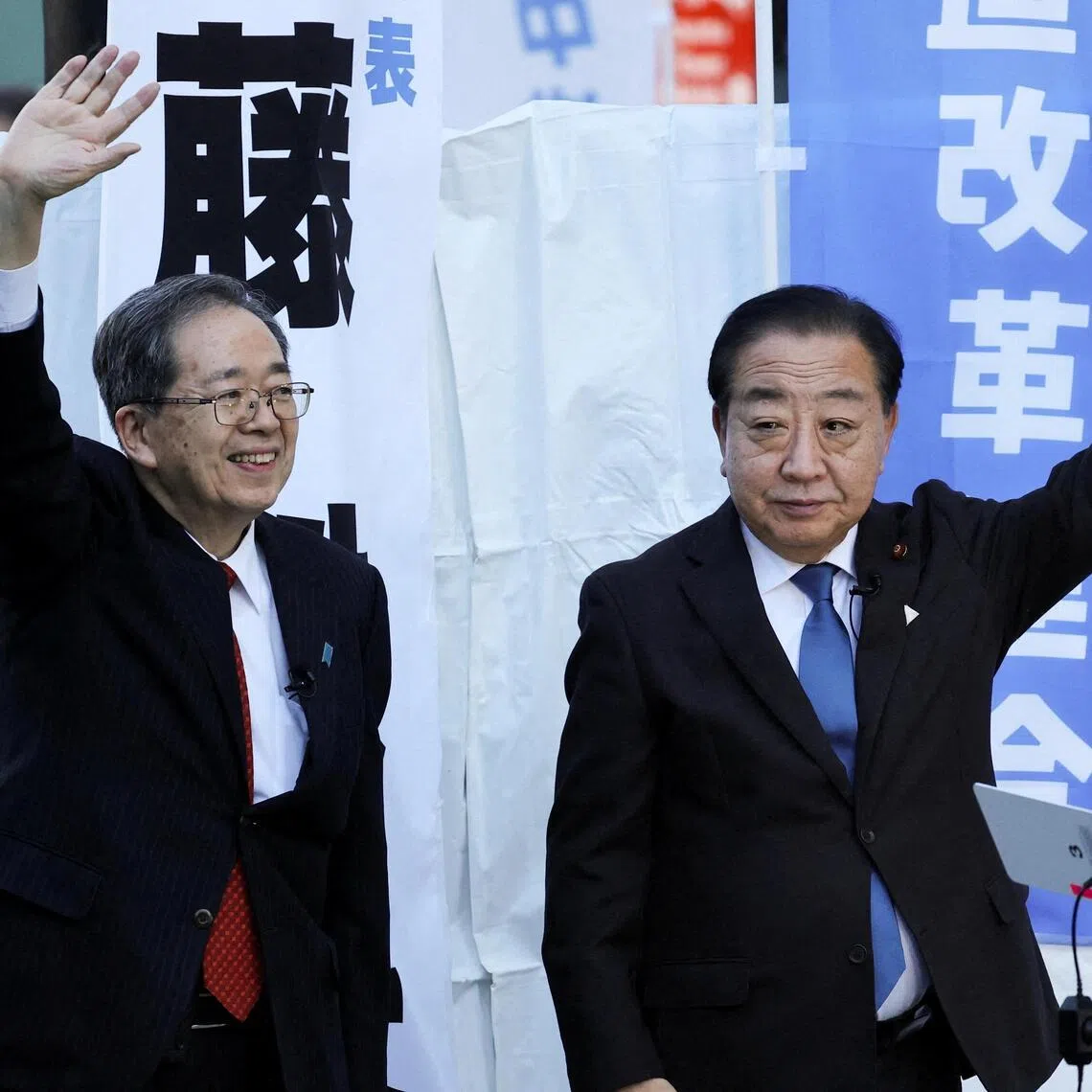 Japan's Centrist Reform Alliance co-leaders Tetsuo Saito and Yoshihiko Noda wave to voters during a campaign event in Tokyo, Japan, on Jan 23.   