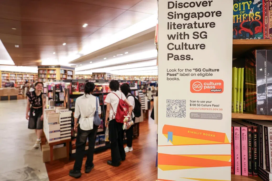 Book displays bearing SG Culture Pass stickers at the Books Kinokuniya main store in Takashimaya Shopping Centre.
