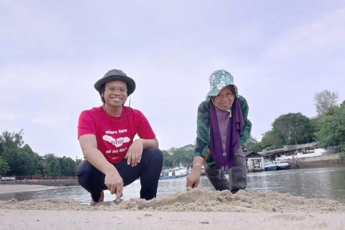 Nor Syazwan Abdul Majid and his mother, now 67, foraging at Changi beach in 2021.