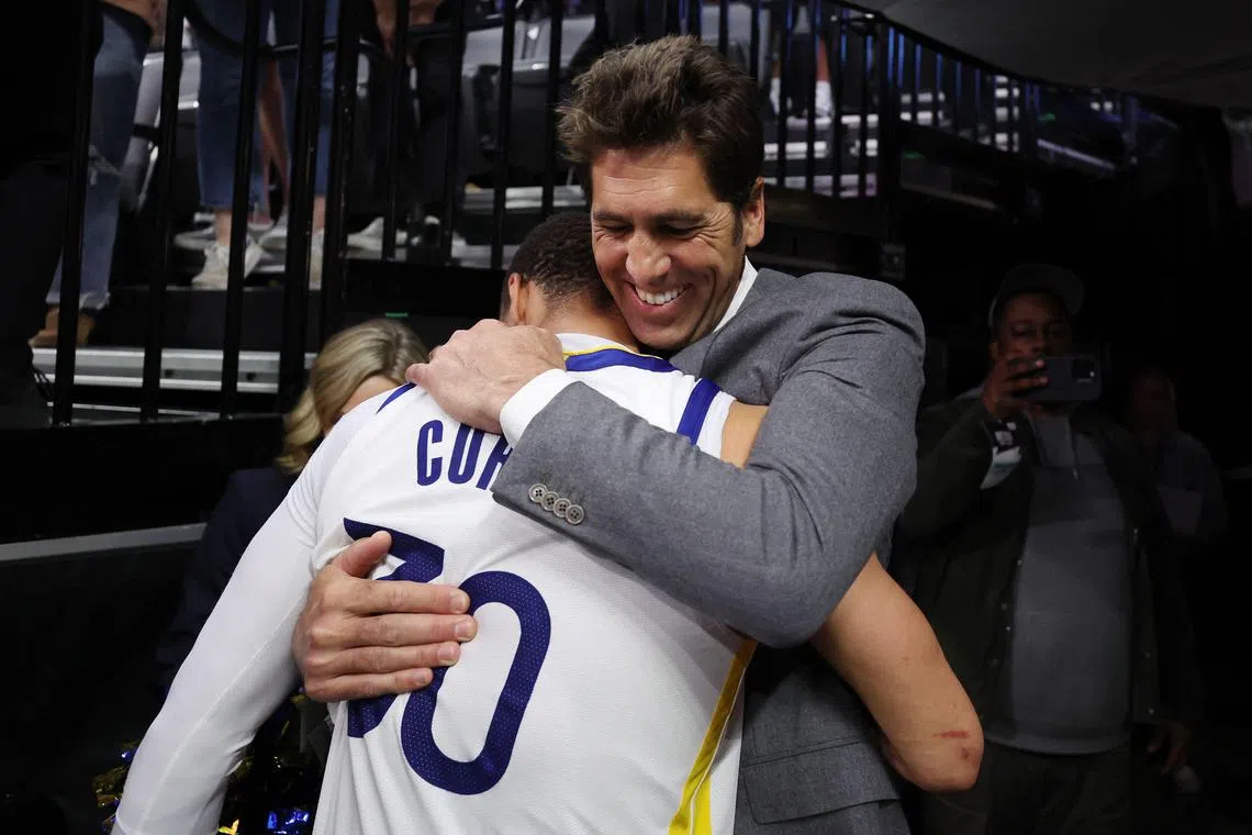Stephen Curry of the Golden State Warriors hugging general manager Bob Myers after the Warriors defeated the Sacramento Kings 120-100 in Game 7 of the Western Conference first round play-offs at Golden 1 Centre in April. Myers is stepping down after 12 years and serving as the architect of four NBA championships. 