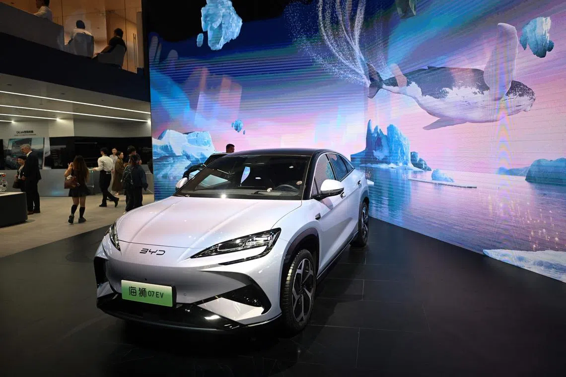 (FILES) A BYD 07 EV model electric car is displayed at the Beijing Auto Show on April 25, 2024. The European Union said this week it would slap additional tariffs of up to 38 percent on Chinese electric car imports from next month after an anti-subsidy probe. (Photo by Pedro PARDO / AFP)