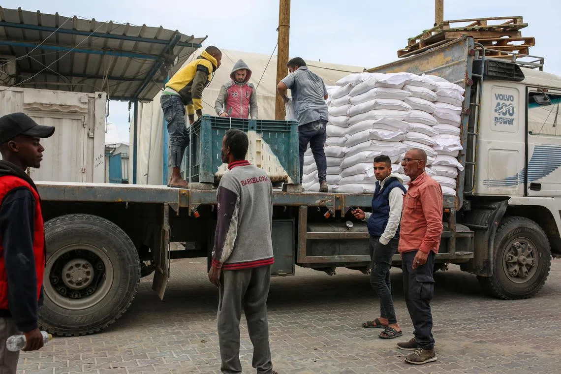 Flour is distributed by the UN Relief and Works Agency in Khan Younis, in the Gaza Strip.