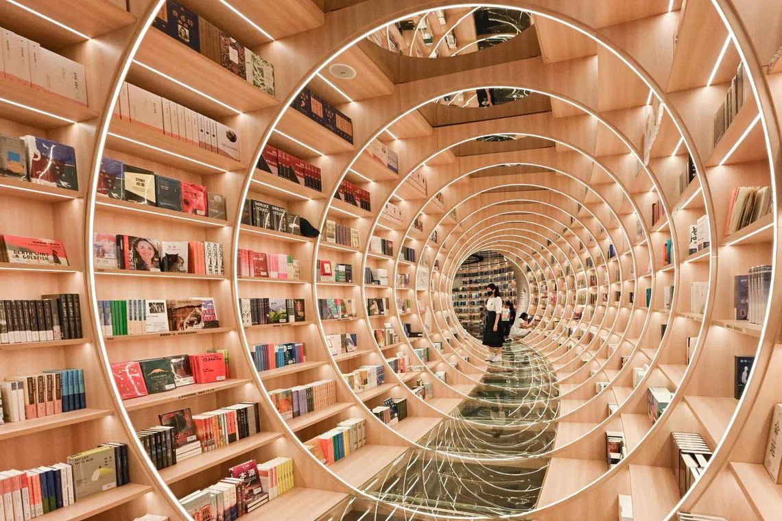 People visiting a book store in Shenzhen, in China's southern Guangdong province, on July 21, 2025. 