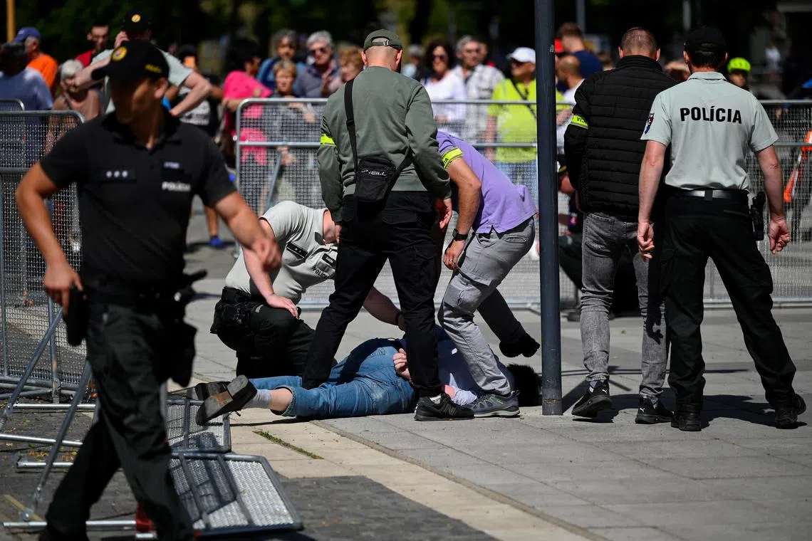 A person is detained after a shooting incident after Slovak government meeting in Handlova, Slovakia, May 15, 2024. REUTERS/Radovan Stoklasa/ File Photo