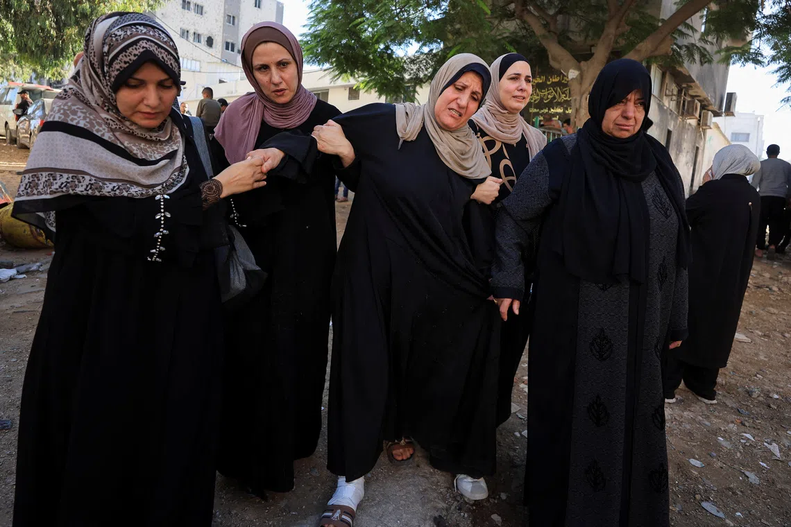 Mourners attend the funeral of Palestinian man Akram Yassin and his wife Dina Abu Baker, who were killed in an Israeli strike, in Gaza City October 20, 2026. REUTERS/Dawoud Abu Alkas