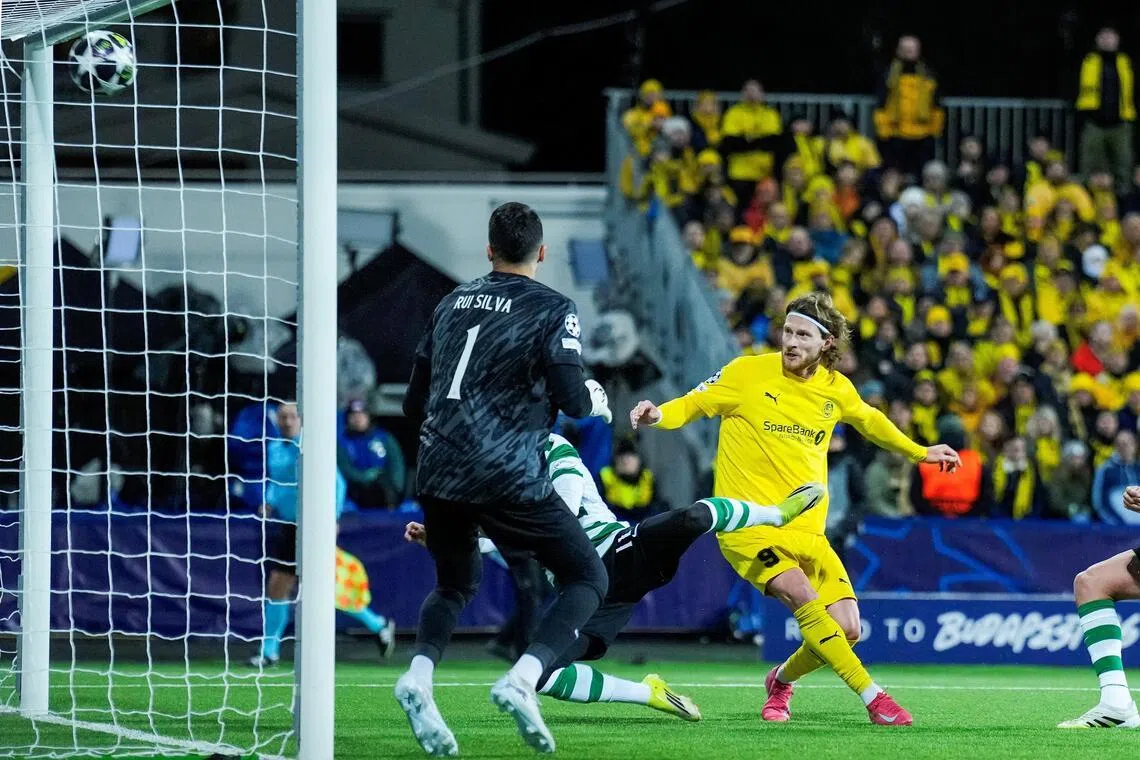 Bodo/Glimt's Kasper Hogh scores their third goal against Sporting Lisbon.