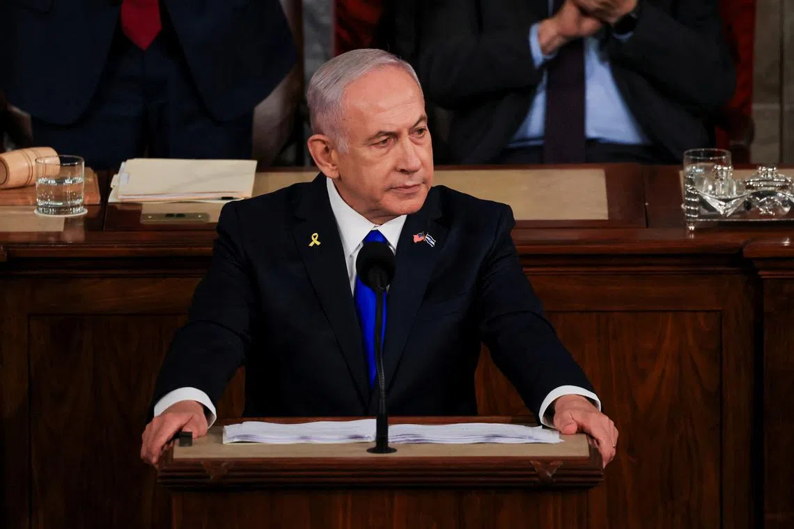 Israeli Prime Minister Benjamin Netanyahu looks on as he addresses a joint meeting of Congress at the U.S. Capitol in Washington, U.S., July 24, 2024. REUTERS/Kevin Mohatt
