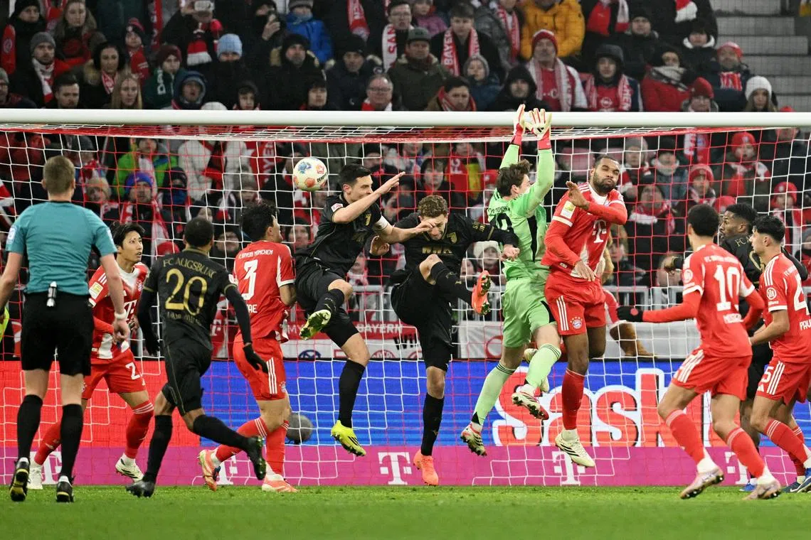 Soccer Football - Bundesliga - Bayern Munich v FC Augsburg - Allianz Arena, Munich, Germany - January 24, 2026 FC Augsburg's Arthur Chaves scores their first goal REUTERS/Angelika Warmuth