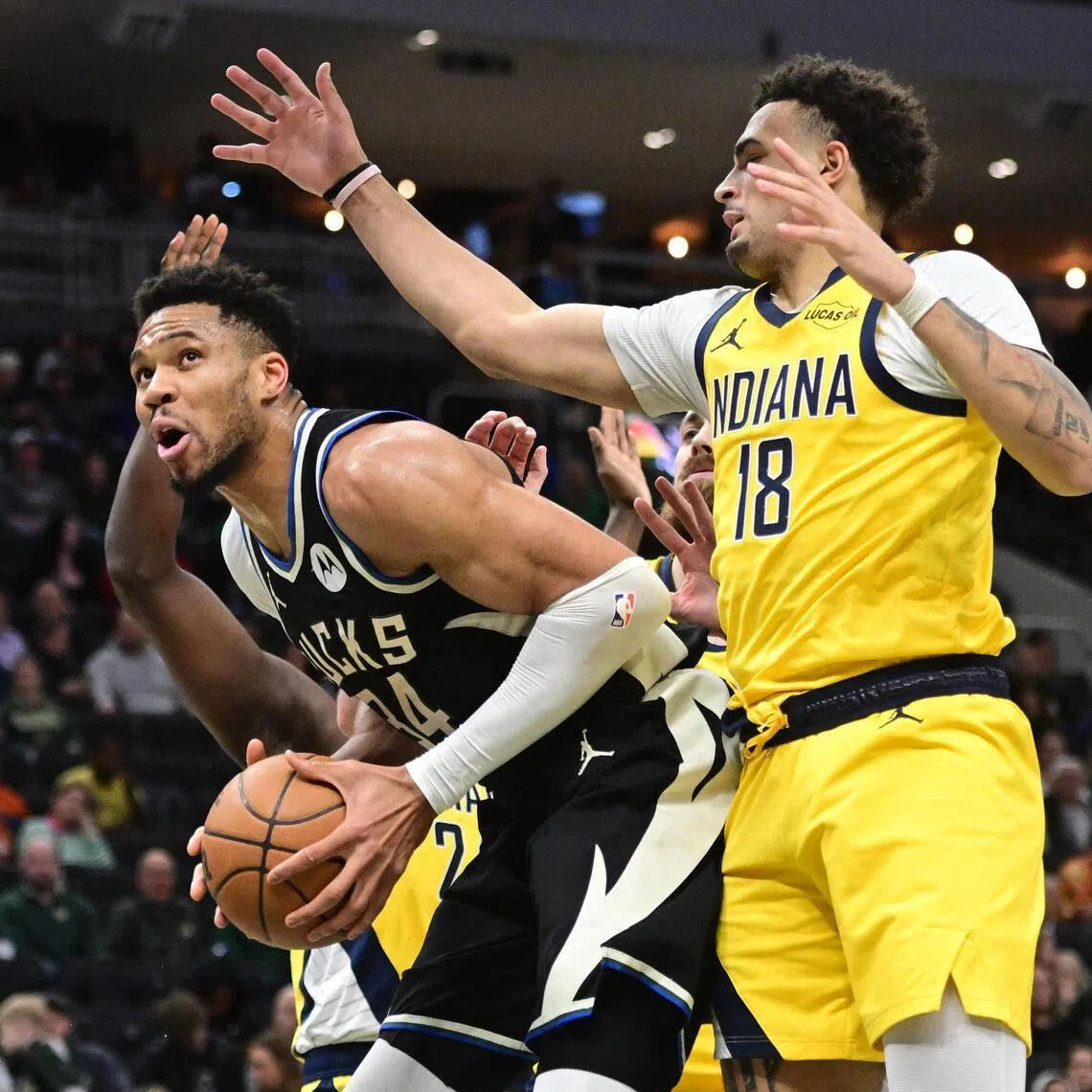 Milwaukee Bucks forward Giannis Antetokounmpo looks for a shot against Indiana Pacers forward Jalen Slawson in the second quarter at Fiserv Forum.