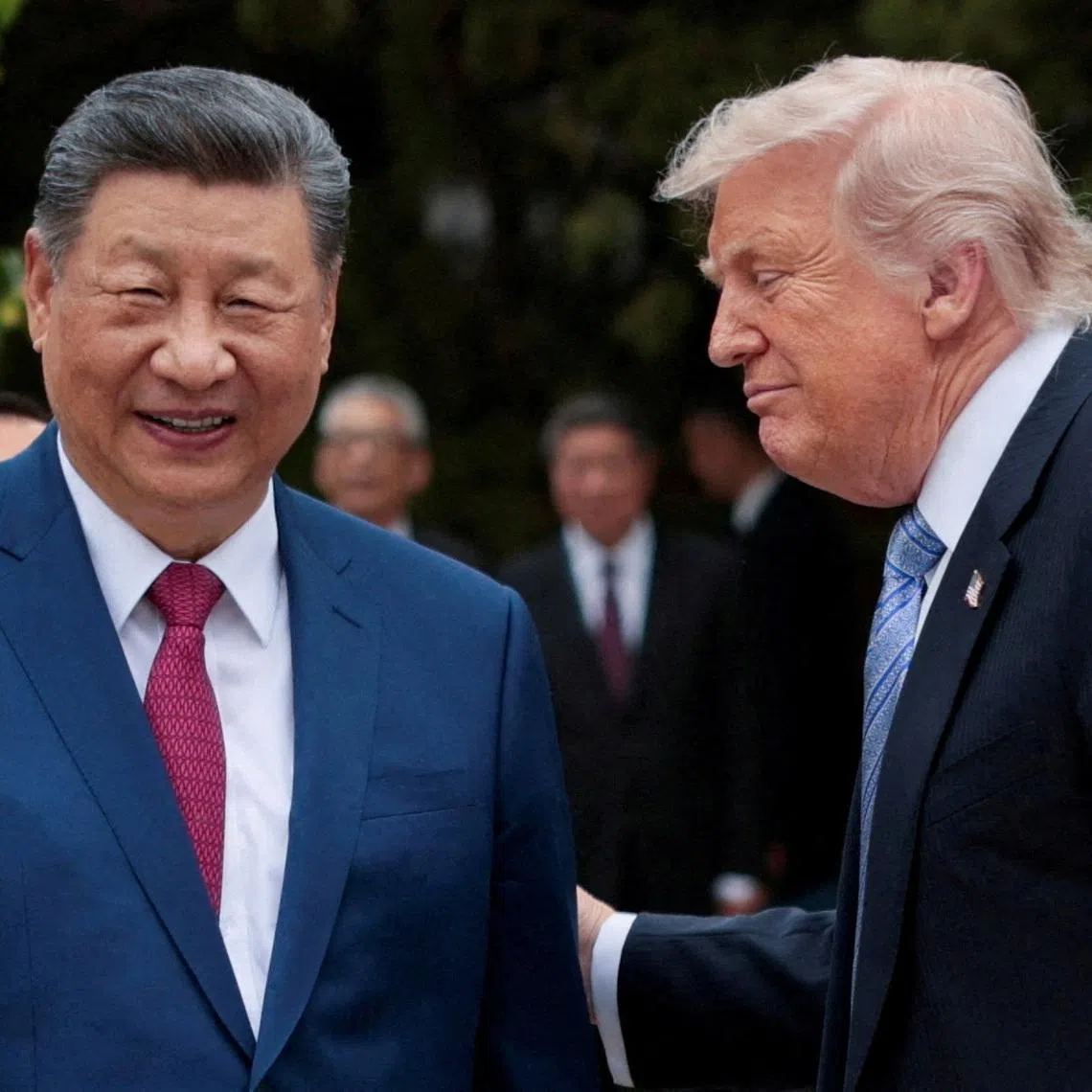 US President Donald Trump (right) speaks with Chinese President Xi Jinping while leaving after a visit to the Zhongnanhai Garden in Beijing, China, on May 15.