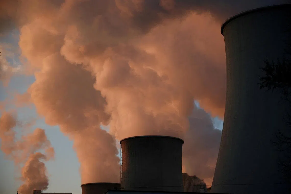 FILE PHOTO: Smoke and steam billow from Belchatow Power Station, Europe's largest coal-fired power plant powered by lignite, operated by Polish utility PGE, in Rogowiec, Poland, November 22, 2023. REUTERS/Kacper Pempel/File Photo