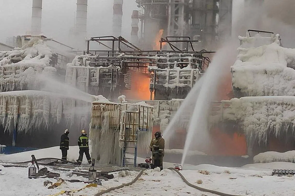 FILE PHOTO: Firefighters work to extinguish fire at a terminal belonging to Novatek, Russia's largest liquefied natural gas producer, in the port of Ust-Luga, Russia, January 21, 2024. Head of Administration of Kingiseppsky District of Leningrad Region Yuri Zapalatsky Telegram channel via REUTERS/File Photo