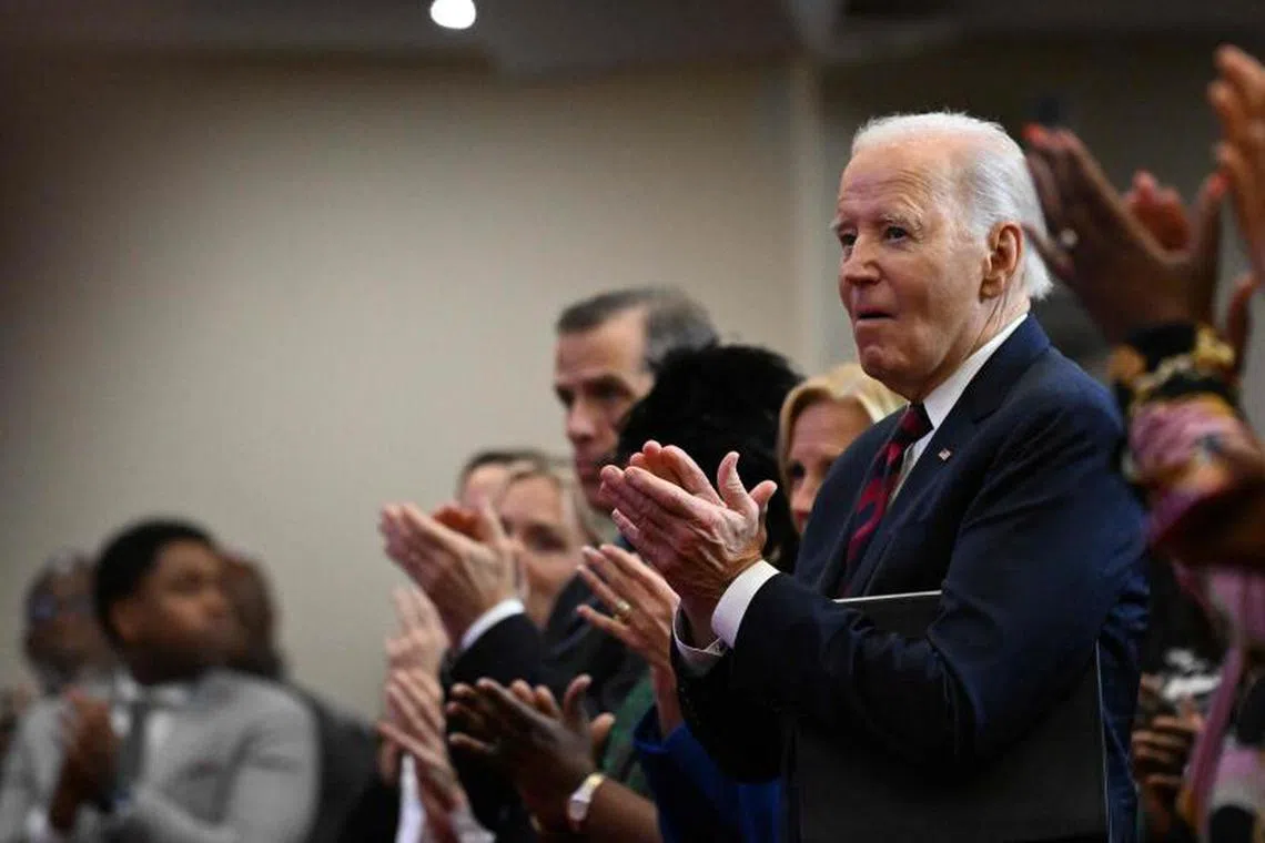 US President Joe Biden applauds as he attends a Sunday service at the Royal Missionary Baptist Church in North Charleston, South Carolina, on January 19, 2025, one day before the Martin Luther King, Jr., Holiday. (Photo by ROBERTO SCHMIDT / AFP)