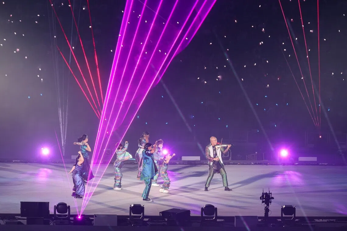 A performance by violinist Han Oh accompanied by dancers during the National Day Parade on Aug 9.
