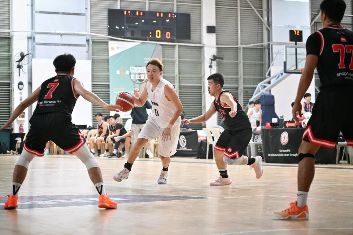 Adroit players in action in their first National Basketball League Division 2 game this season against Sin Kee at Singapore Basketball Centre, on Oct 24.