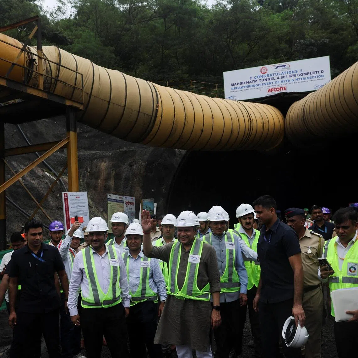 Ashwini Vaishnaw, Union Minister of Railways of India waves to media outside a tunnel completed as part of the Mumbai–Ahmedabad bullet train project in Navi Mumbai, India, September 20, 2025. REUTERS/Francis Mascarenhas
