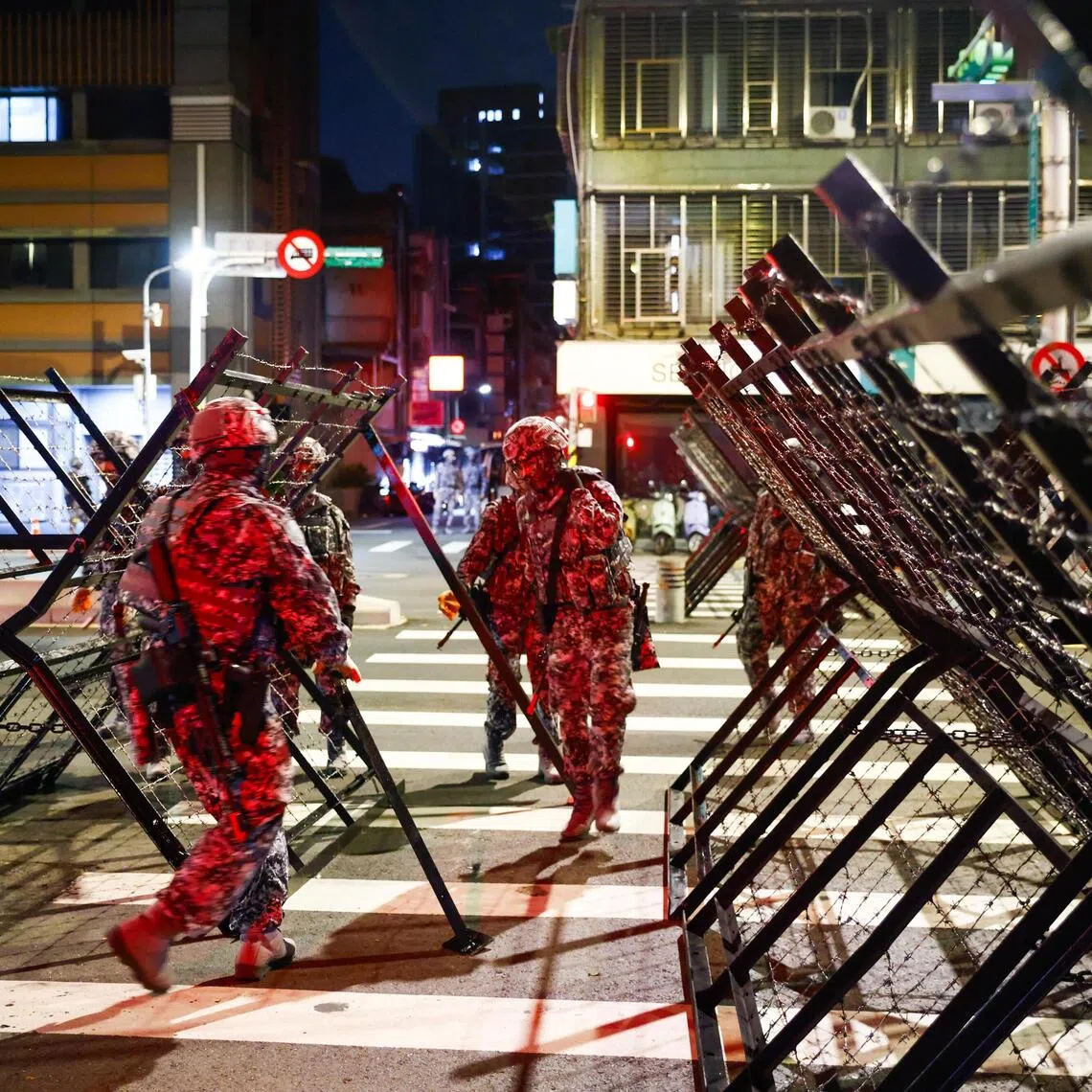 Taiwanese military police install road blockades during a drill as part of the annual Han Kuang military exercises in Taipei.