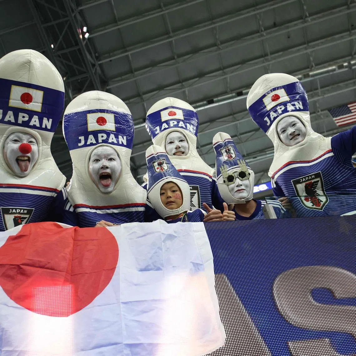 Japanese fans in costume as they support their team against Netherlands on June 14.