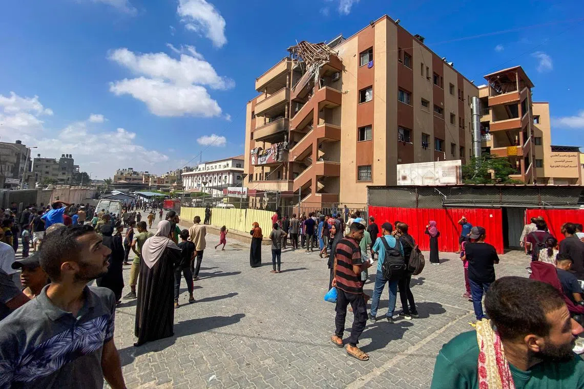 Palestinians gather outside Nasser hospital in Khan Yunis in the southern Gaza Strip on August 25, following Israeli strikes.