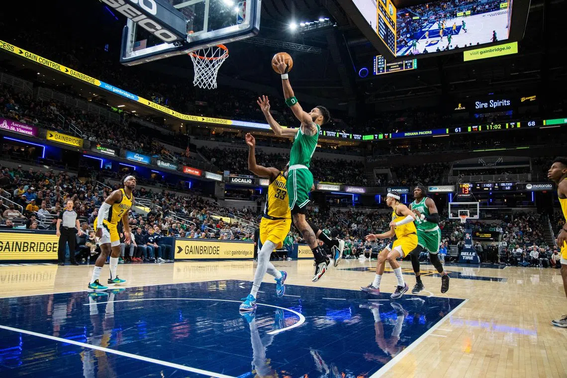 Boston Celtics forward Jayson Tatum shooting while Indiana Pacers centre Myles Turner attempts to defend the hoop on Thursday. 