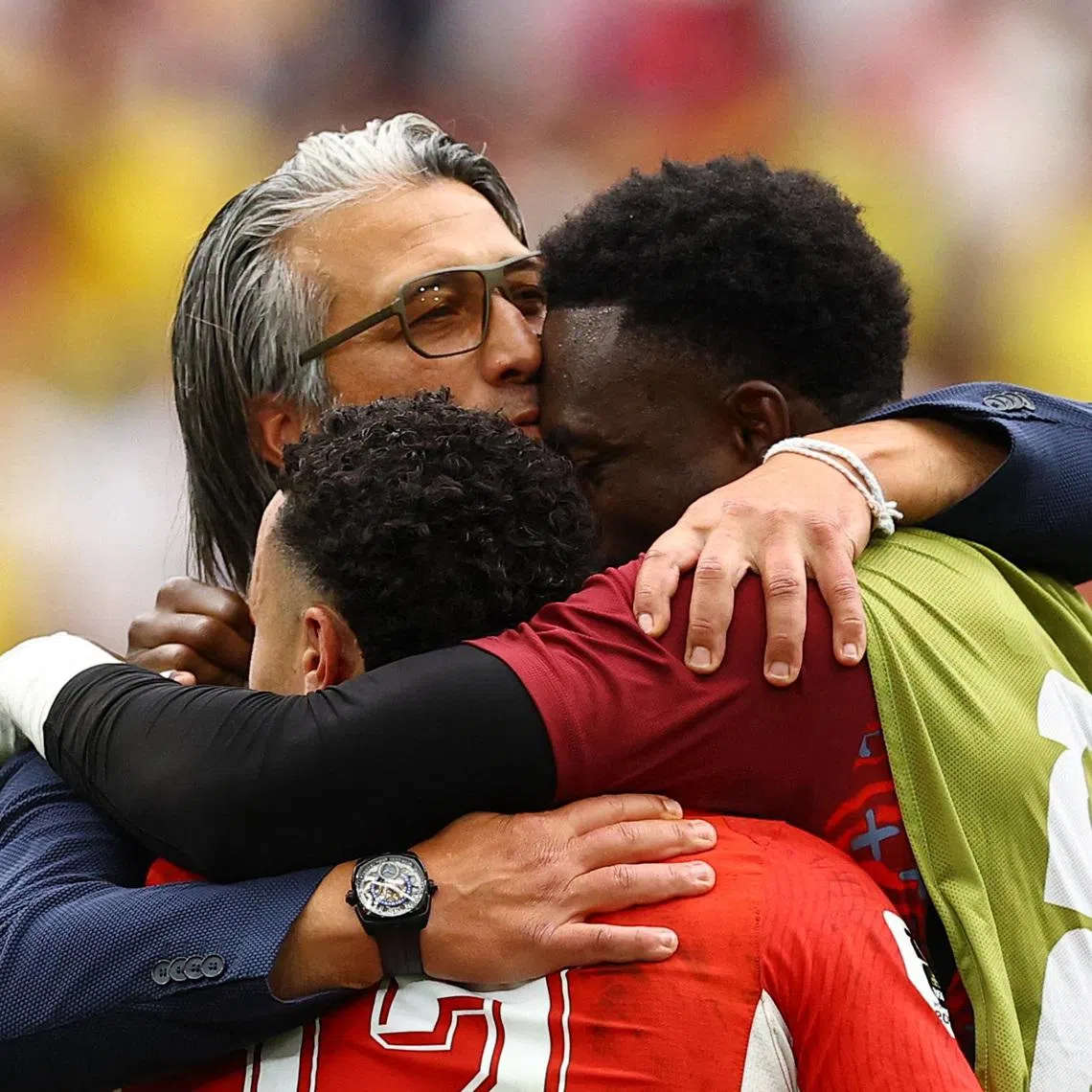 Switzerland coach Murat Yakin celebrates with his players.