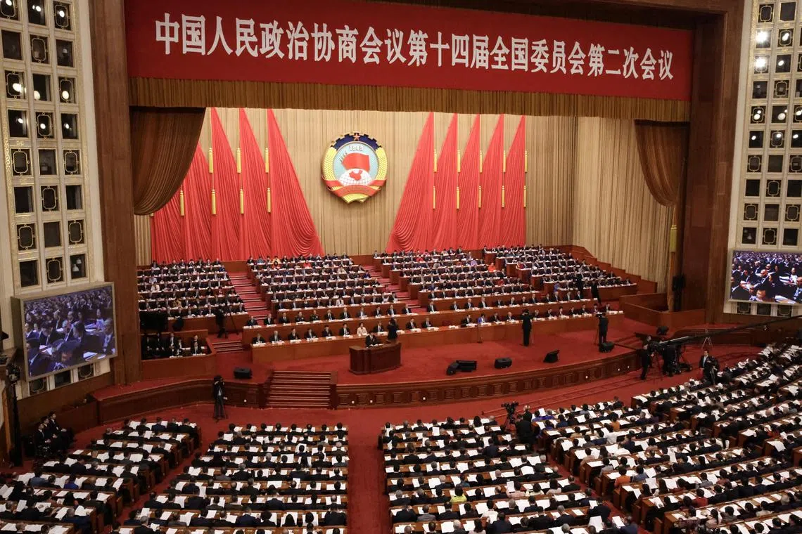 Delegates listening to the speech of the chairman of the Chinese People's Political Consultative Conference Wang Huning during the conference's opening ceremony on March 4.