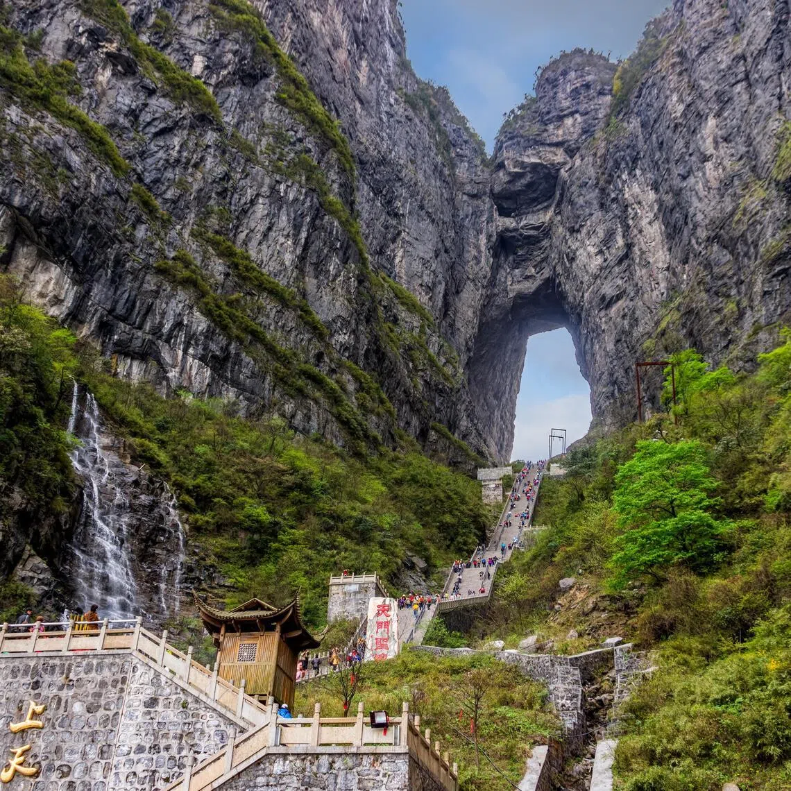 Tianmen Cave is a massive, high-altitude natural karst arch  located in Tianmen Mountain National Forest Park in Zhangjiajie, in the northwestern part of Hunan province, China. 