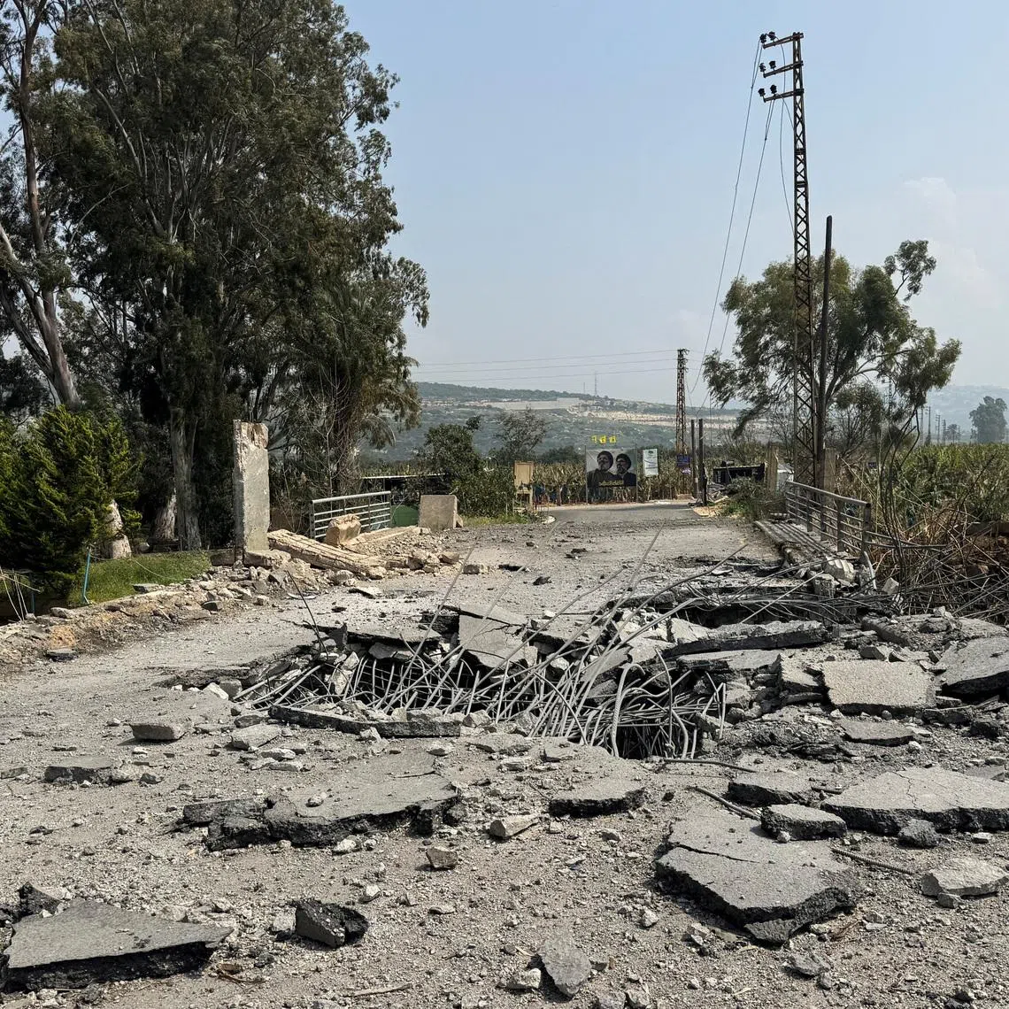 The damaged Qasmiyeh Bridge over the Litani river, after it was hit by an Israeli strike in southern Lebanon on Wednesday, March 18, following an escalation between Hezbollah and Israel amid the U.S.-Israeli conflict with Iran, Lebanon, March 19, 2026. Picture taken with a mobile phone. REUTERS/Ali Hankir/File Photo
