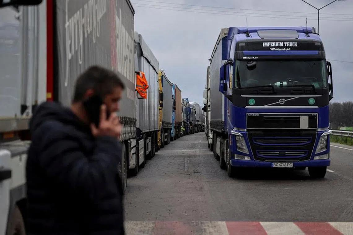 FILE PHOTO: Trucks wait for crossing the Ukraine-Poland border, as Russia's attack on Ukraine continues, at the checkpoint Rava-Ruska, Lviv region, Ukraine April 17, 2023. REUTERS/Roman Baluk/File Photo