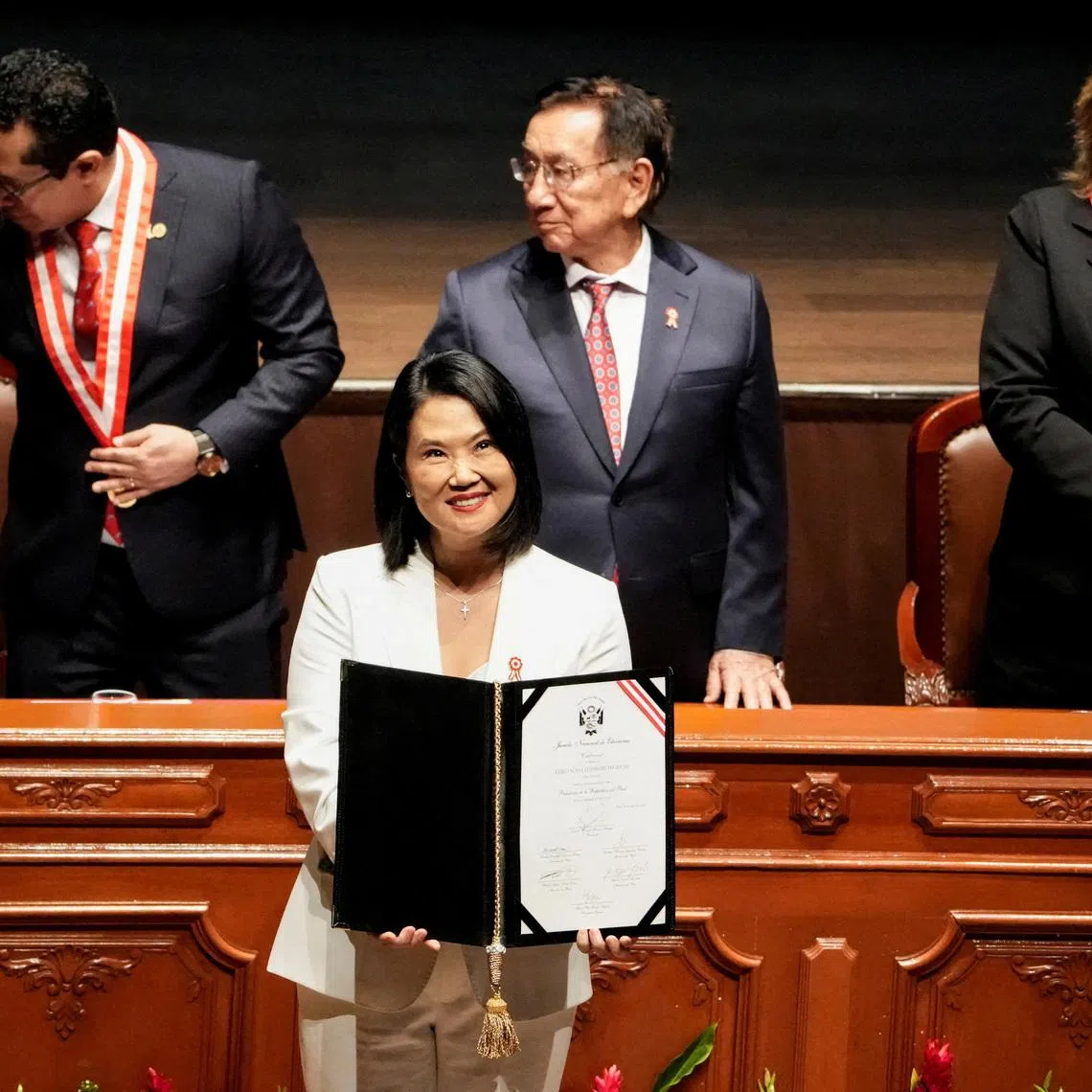 Peru’s President-elect Keiko Fujimori holds her official credentials, following her victory in the presidential run-off in Lima, Peru, on July 15.