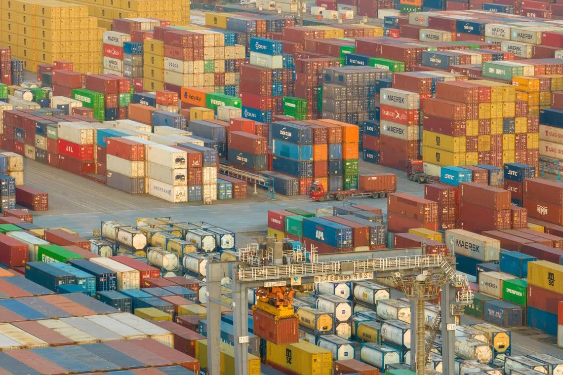 Shipping containers stacked at Nanjing port in Jiangsu province on Jan 3, 2023.
